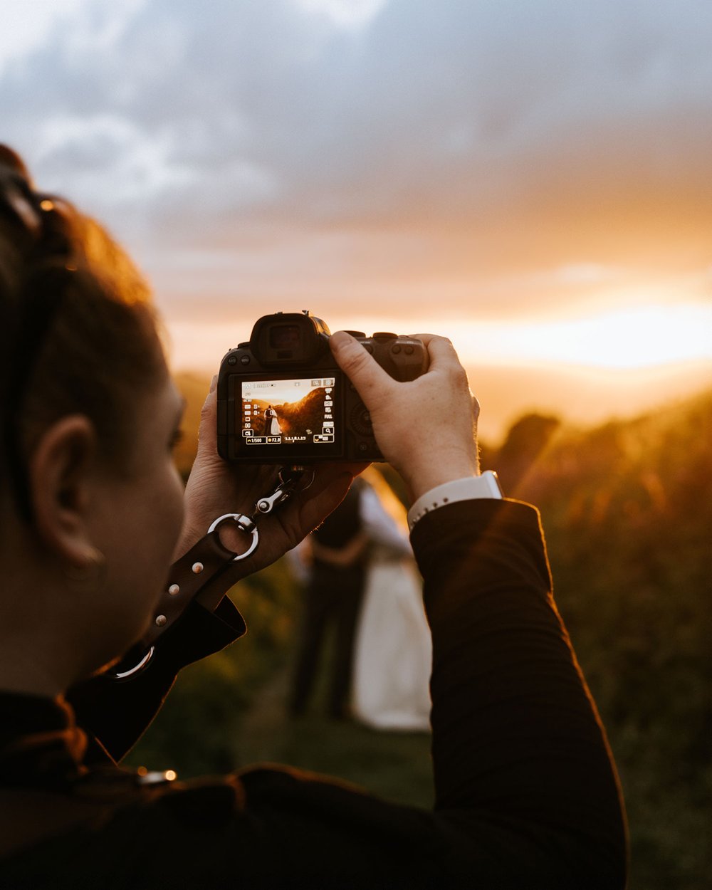 Photographer taking a photo of the sunset