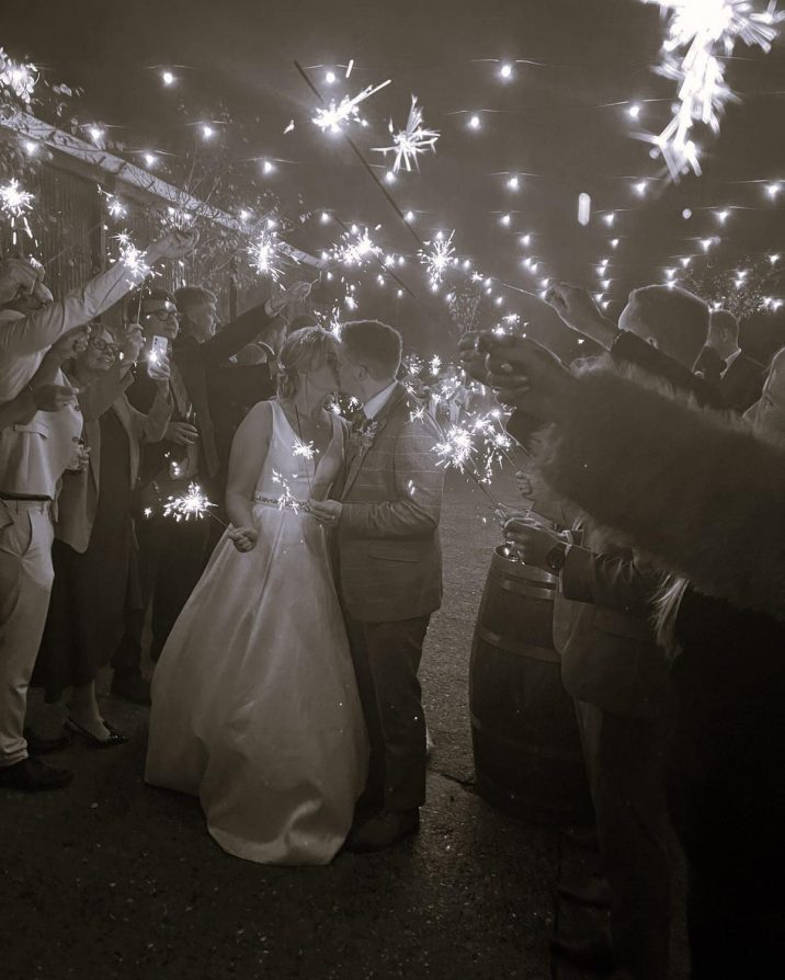 Bride and groom outside with sparklers